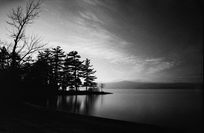Half frozen Lake George in spring. 30 second exposure with a red filter